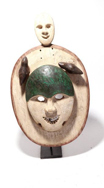 Decorative anthropomorphic mask with a smiling...