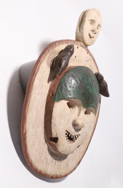 Decorative anthropomorphic mask with a smiling...