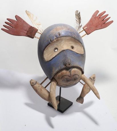 Decorative anthropomorphic mask with an oval...