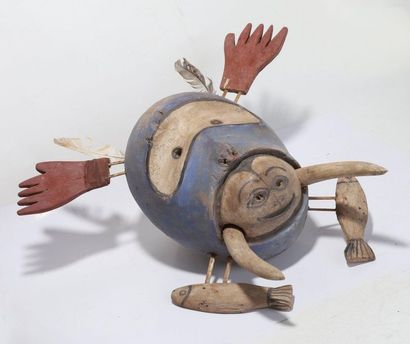 Decorative anthropomorphic mask with an oval...