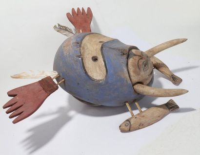 Decorative anthropomorphic mask with an oval...