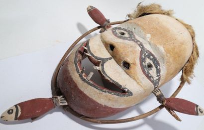 Anthropomorphic decorative mask with an oval...