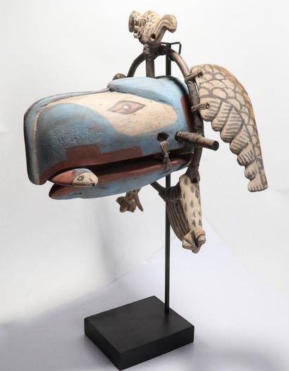 Decorative zoomorphic mask with a raptor...