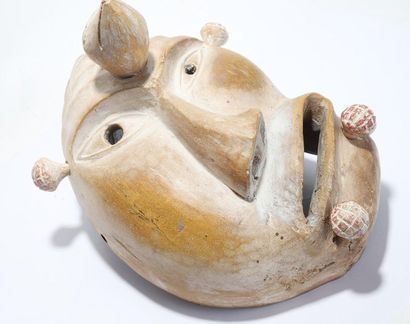 Decorative mask with a deformed face 
 
Wood,...