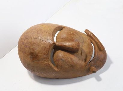Anthropomorphic decorative mask with a smiling...