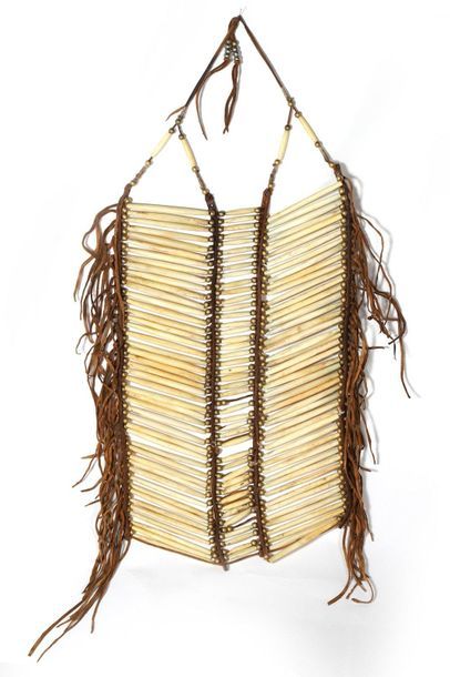 Pectoral made of oblong bone beads connected...