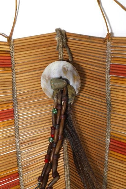 Pectoral made of oblong bone beads connected...