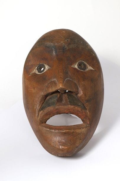 Mask with a sculpted human face, high cheekbones,...