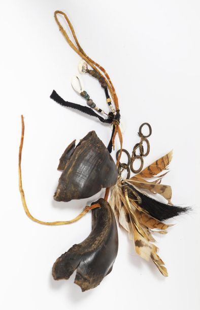 Ritual ornament composed of cowries, ruminant...