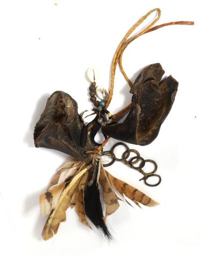 Ritual ornament composed of cowries, ruminant...