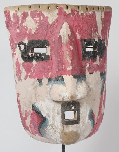 Mask made of light polychrome wood with pink...