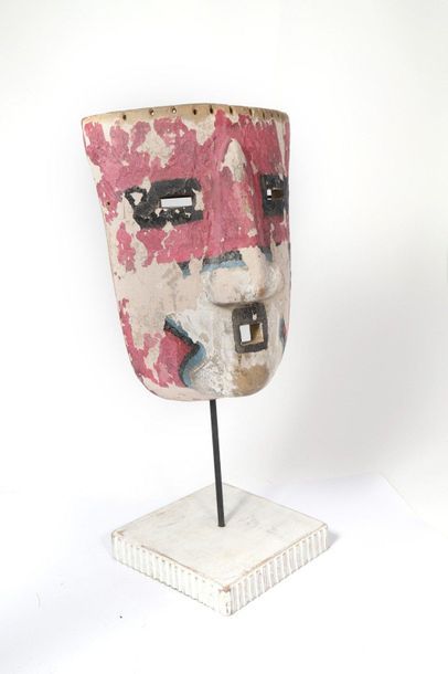 Mask made of light polychrome wood with pink...