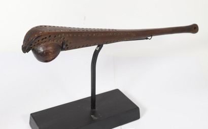 Wooden tomahawk with a patina of wood forming...