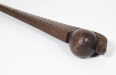 Wooden tomahawk with a patina of wood forming...
