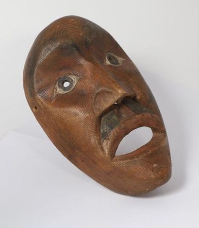 Mask with a sculpted human face, high cheekbones,...