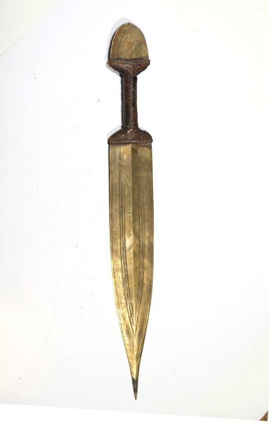 Small knife with a ribbed brass blade and...