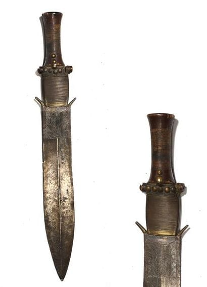 An old knife characterized by its work of...