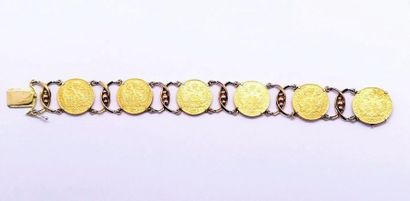 BRACELET en or jaune 18K (750/°°) orné de...