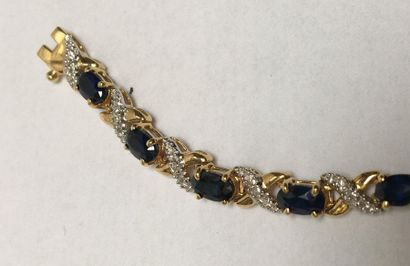 BRACELET en or jaune et or gris 18k (750/°°)...