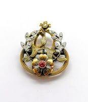 BOUTON DE CORSAGE en or jaune 18K (750/°°),...