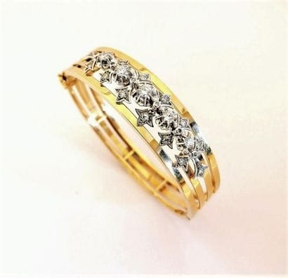 BRACELET en or jaune 18K (750/°°), ouvrant,...