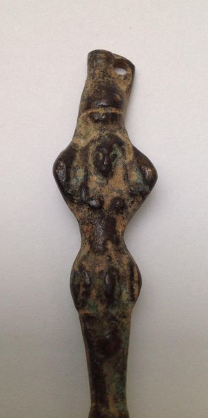 Bronze pin with a green patina in Roman style...