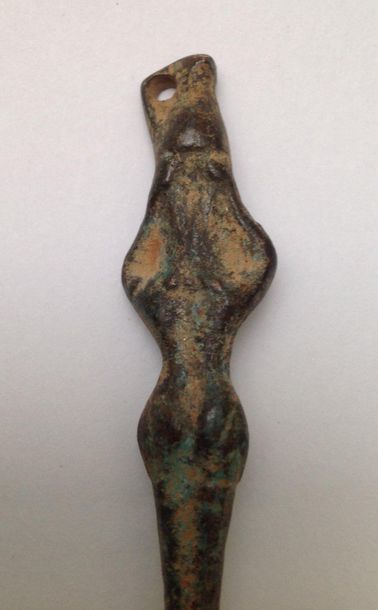 Bronze pin with a green patina in Roman style...