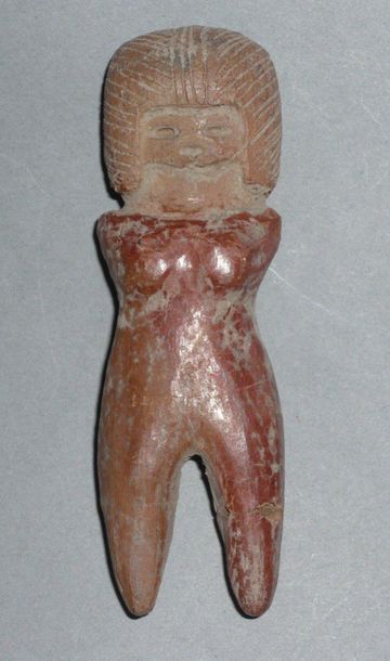 Female terracotta figurine with finely incised...