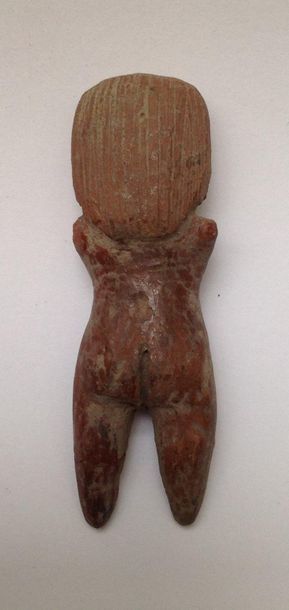 Female terracotta figurine with finely incised...