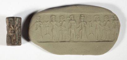 Cylinder seal in black stone representing...