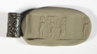 Hematite cylinder seal representing a finely...