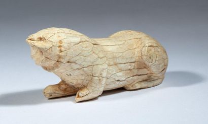 Lion lying in ivory. 

Persia, first millennium...