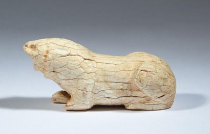 Lion lying in ivory. 

Persia, first millennium...