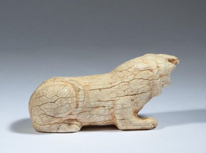 Lion lying in ivory. 

Persia, first millennium...