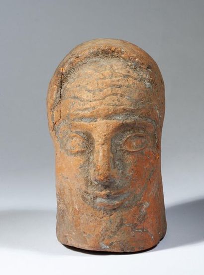 Red terracotta head presenting a dignitary.

Etruscan...