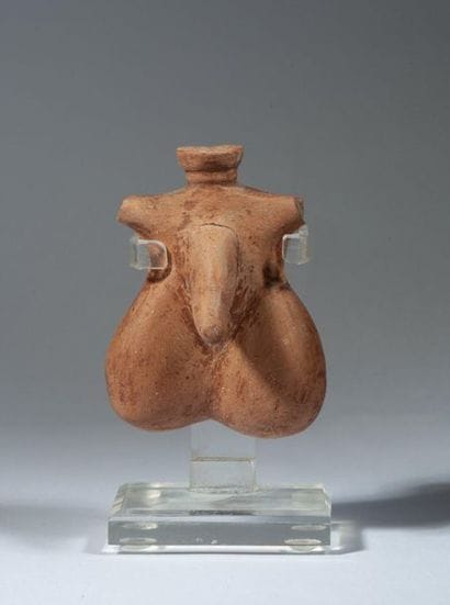 Beige terracotta oenochoe of phallic shape....