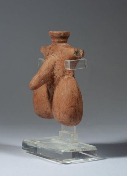 Beige terracotta oenochoe of phallic shape....