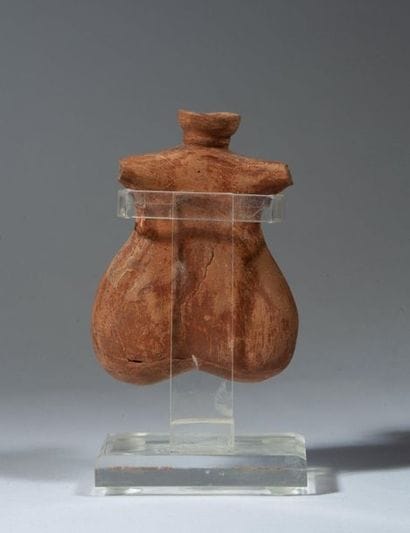 Beige terracotta oenochoe of phallic shape....