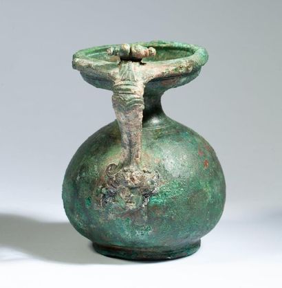 Bronze vase with green patina, the handle...