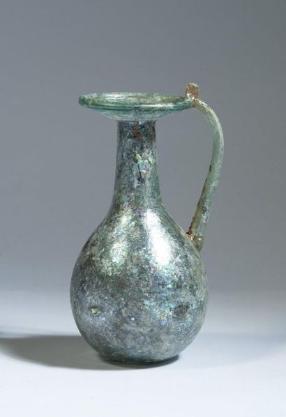 Iridescent glass ball vase with depressions...