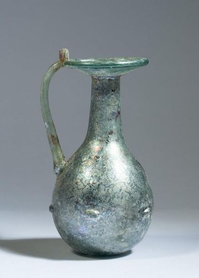 Iridescent glass ball vase with depressions...