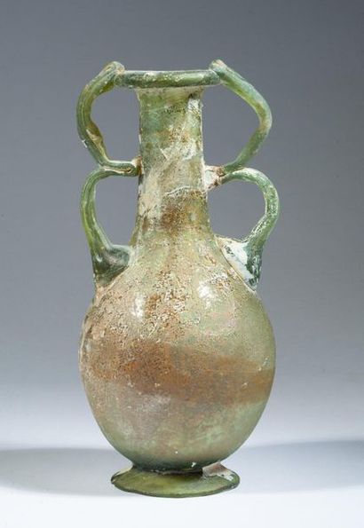 Iridescent glass bottle with four handles...