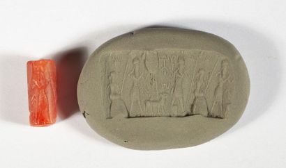 Carnelian cylinder seal with adoration figures.

End...