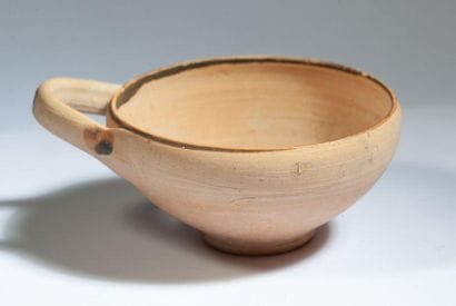 Beige terracotta tase with one handle painted...