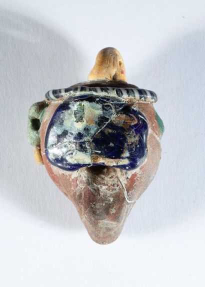 Phoenician-style glass head. (Broken)

H:...