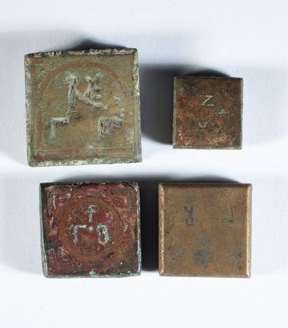 Set of four bronze weights finely engraved...