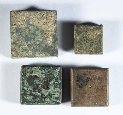 Set of four bronze weights finely engraved...