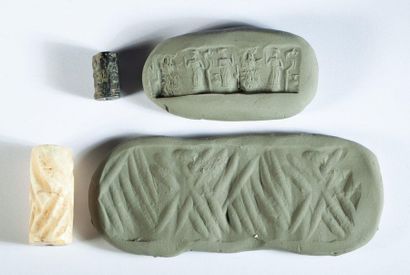 Set of two cylinder seals. 

One in marble...