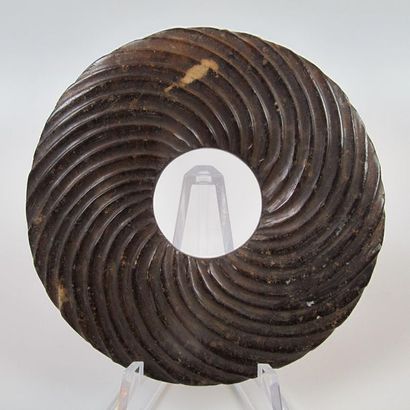 Bi disc with spiral decoration. Brown nephrite...