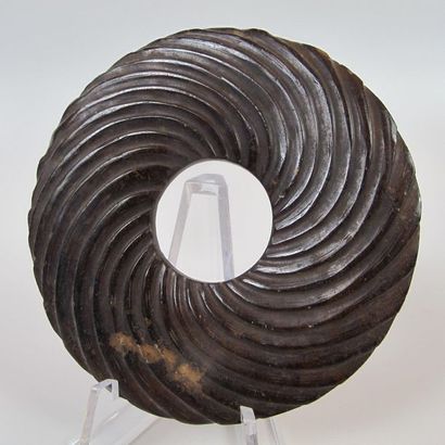 Bi disc with spiral decoration. Brown nephrite...
